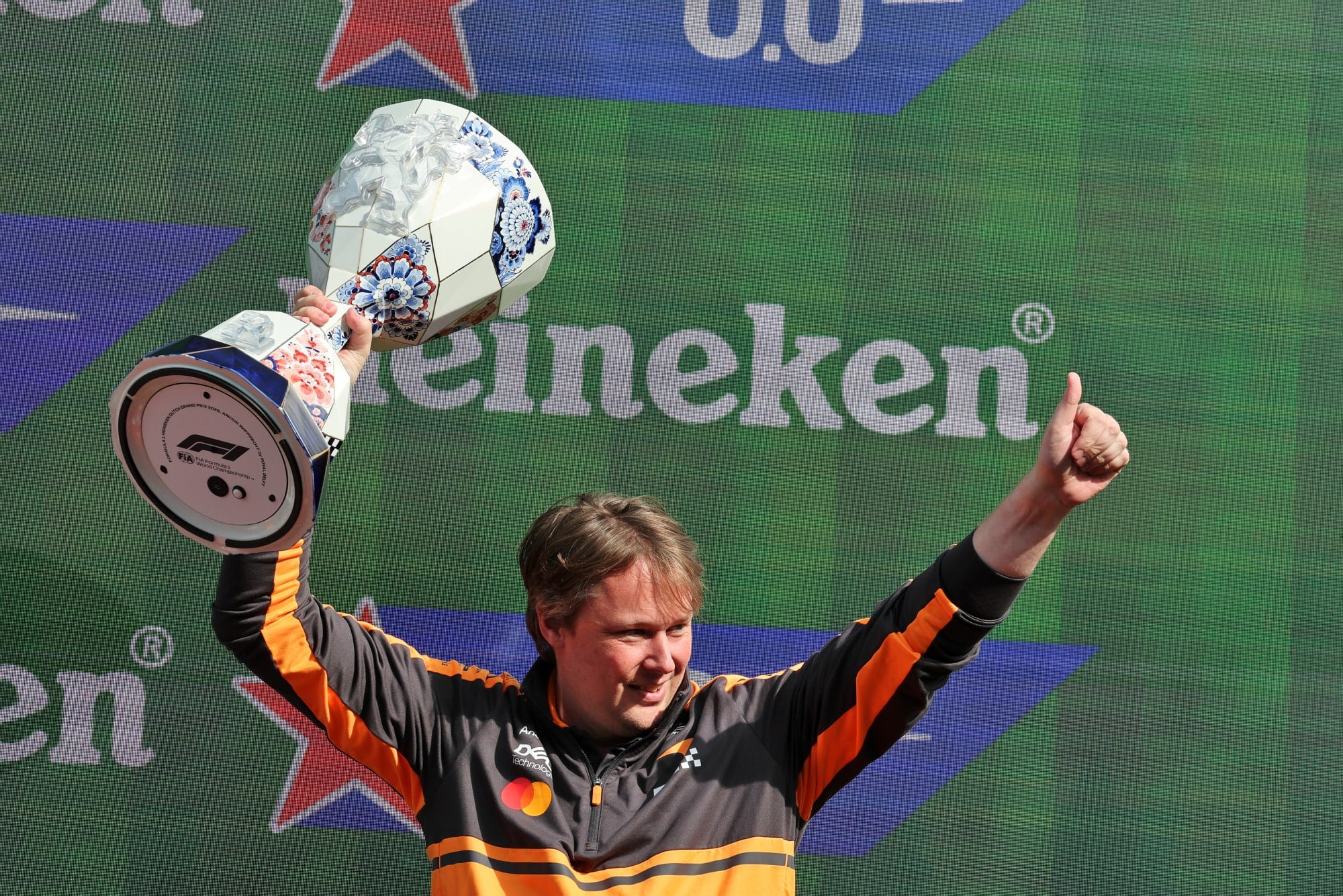 Adrian Goodwin (GBR) McLaren F1 Team Associate Director, Race Engineering celebrates on the podium.