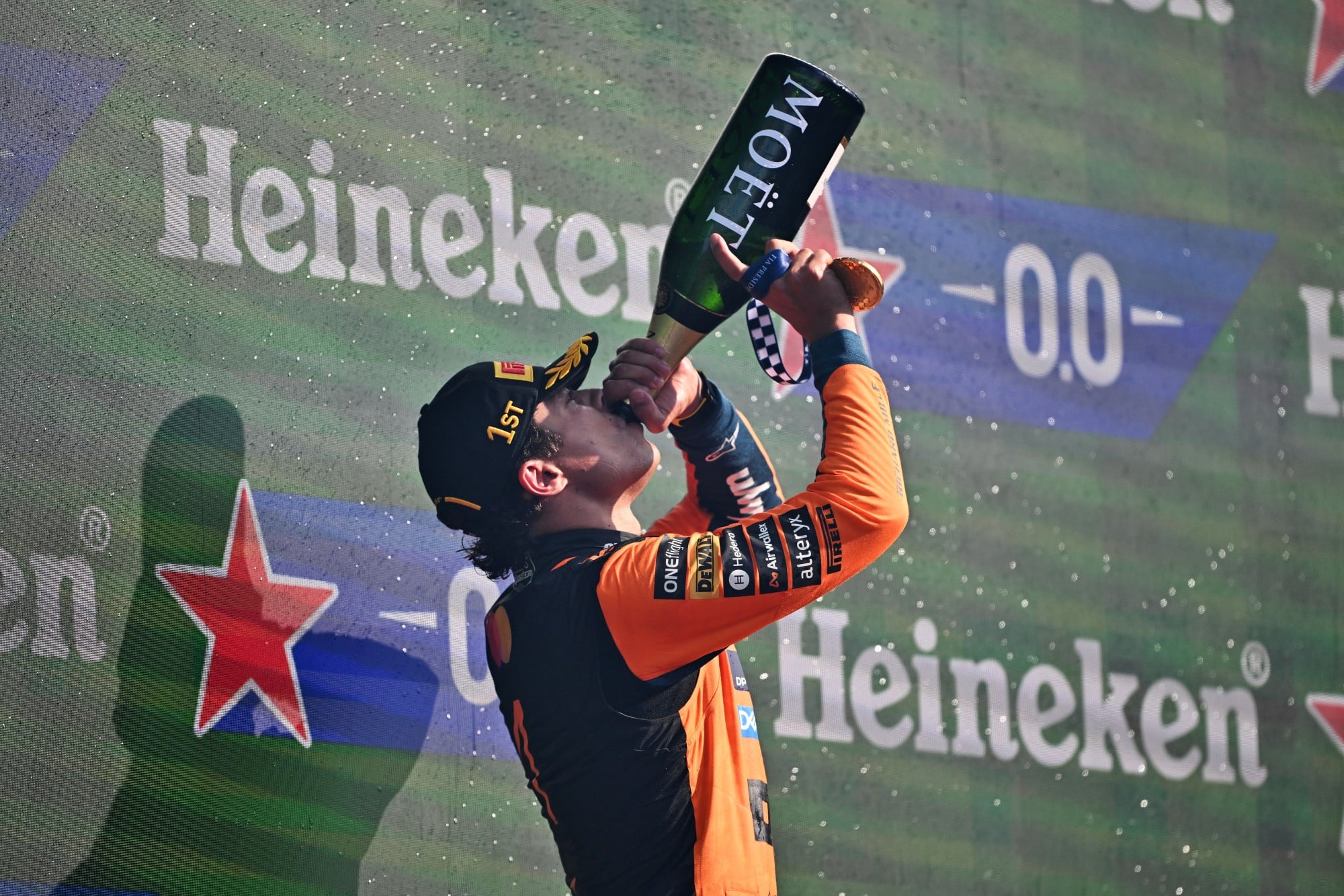 Race winner Lando Norris (GBR) McLaren F1 Team celebrates on the podium.