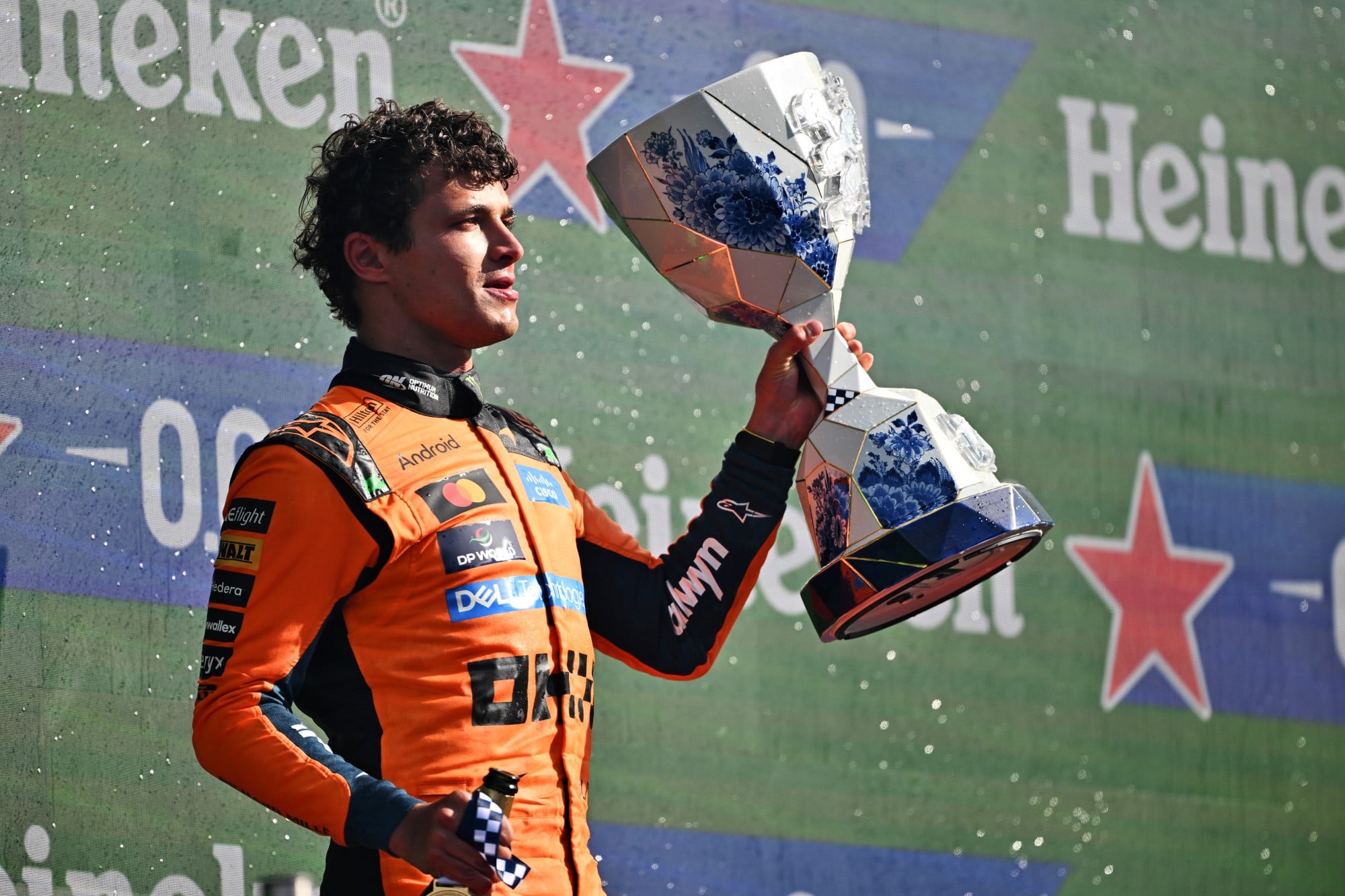 Race winner Lando Norris (GBR) McLaren F1 Team celebrates on the podium.