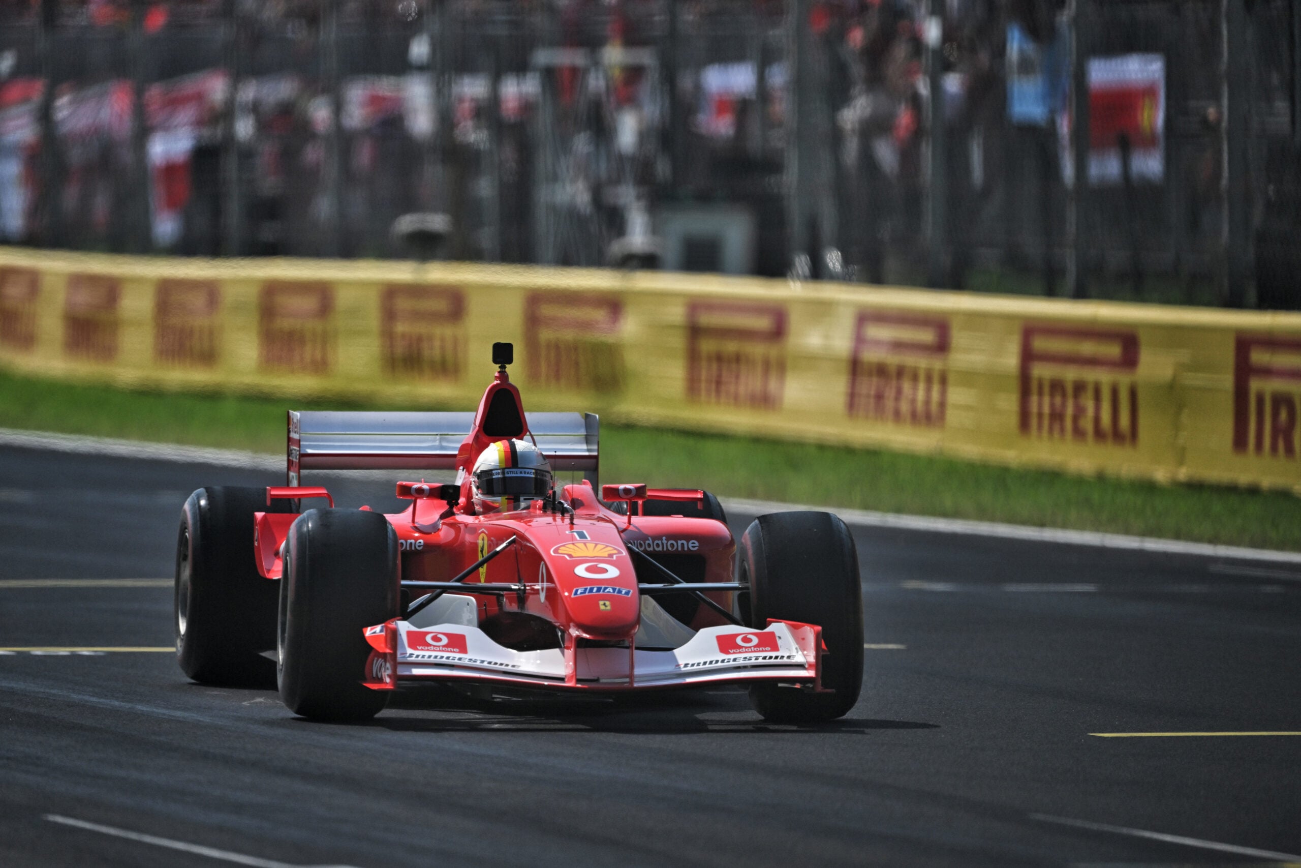 Sebastian Vettel (GER) drives the 2002 Ferrari F2002.