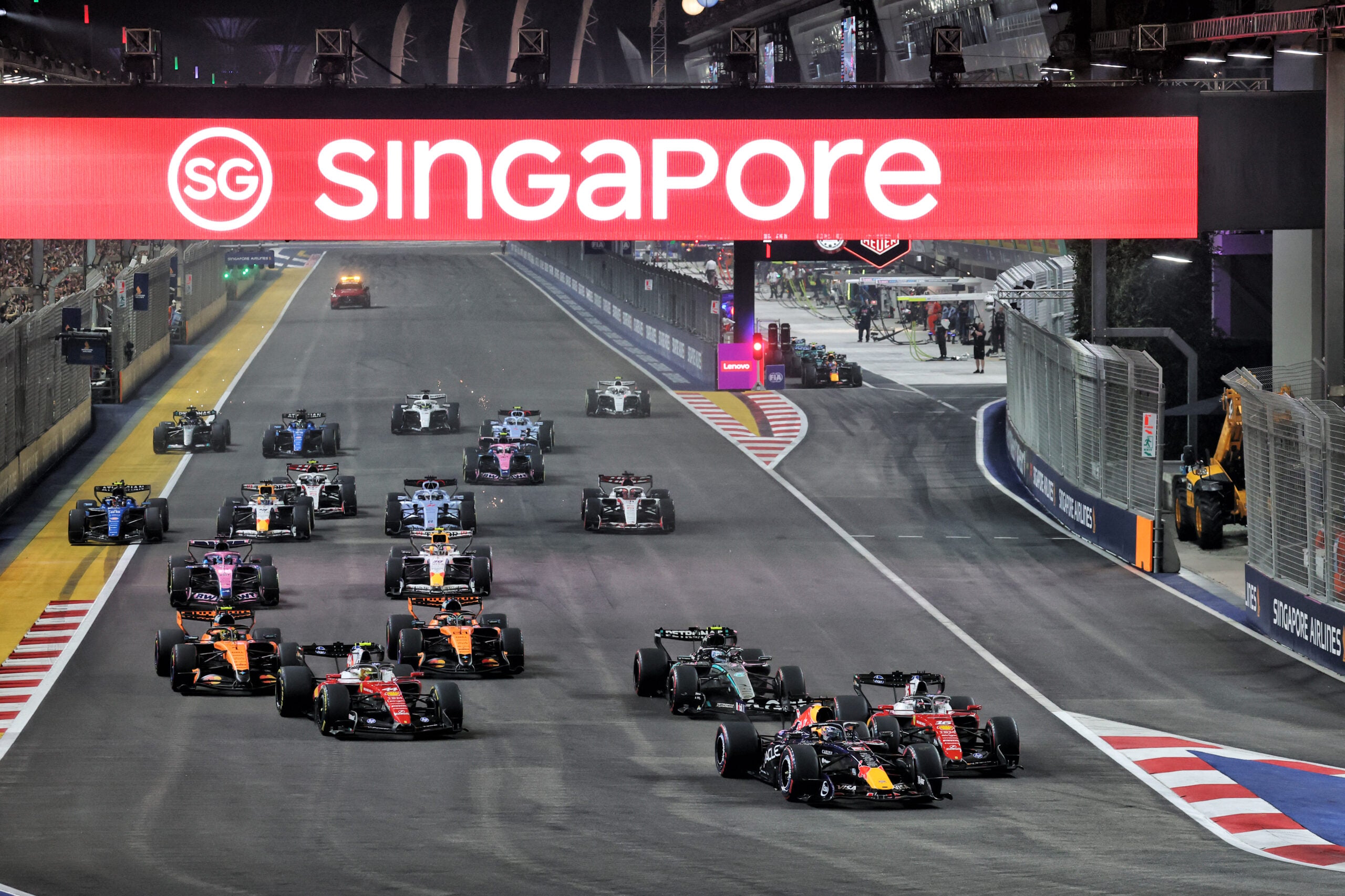 Max Verstappen (NLD) Red Bull Racing RB22 leads at the start of the race.