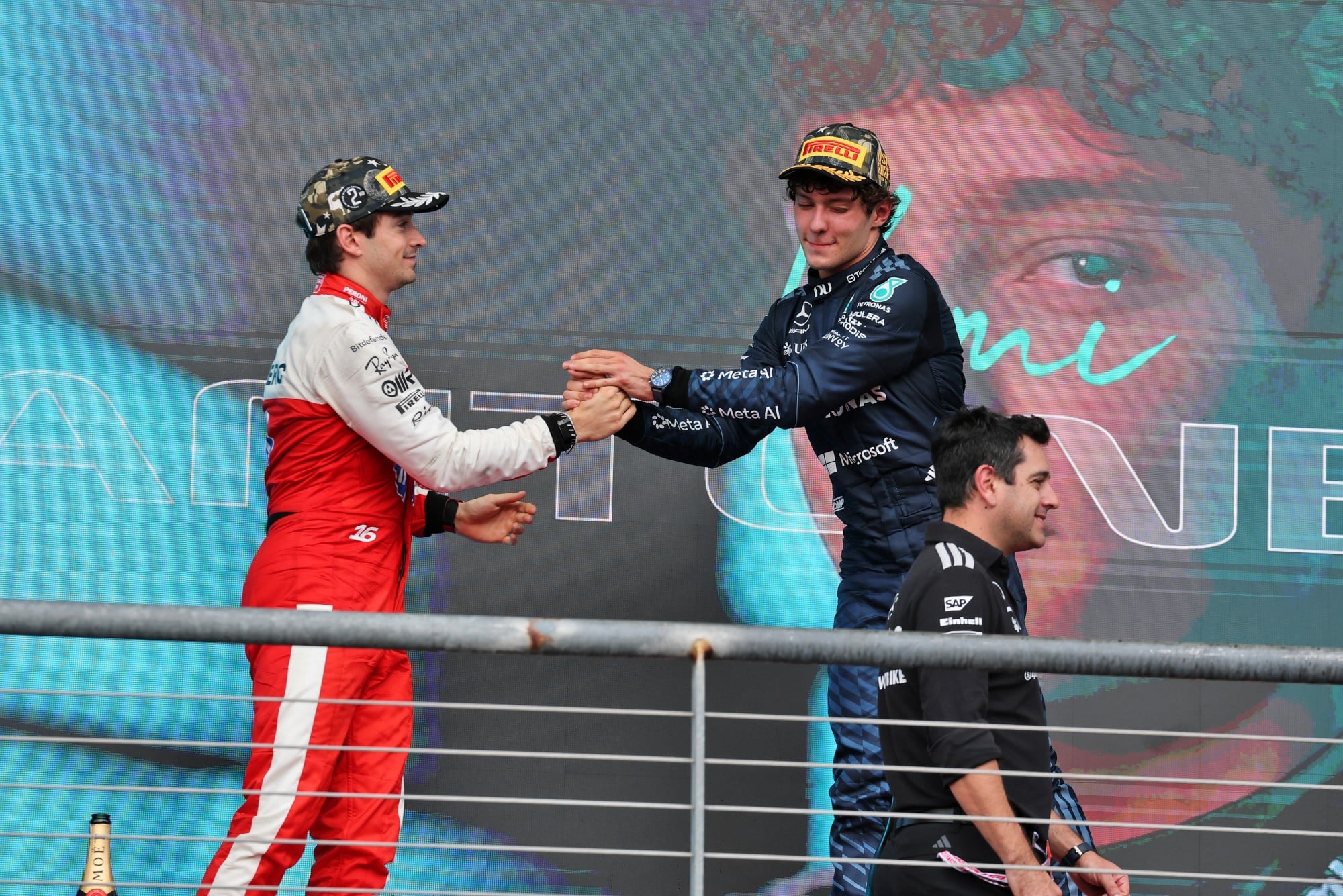 (L to R): Charles Leclerc (MON) Scuderia Ferrari celebrates his second position on the podium with race winner Andrea Kimi Antonelli (ITA) Mercedes AMG Formula One Team.